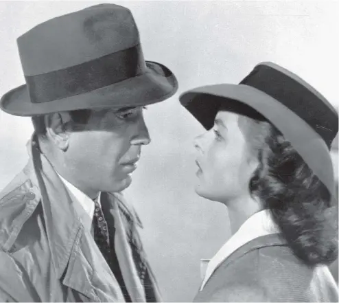  ?? WARNER BROS. / THE ASSOCIATED PRESS ?? Humphrey Bogart and Ingrid Bergman in Casablanca, which appeared only a year after the United States entered the Second World War. Looked at in history, Rick (Bogart) seems to enact the movement of American opinion as it gives up isolationi­sm.