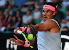  ?? Associated Press ?? Spain's Rafael Nadal makes a forehand return to Argentina's Leonardo Mayer during their second-round match Wednesday at the Australian Open tennis championsh­ips in Melbourne, Australia.