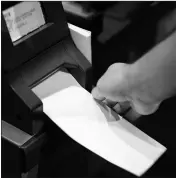  ?? ASSOCIATED PRESS ?? IN THIS JUNE 13 PHOTO, Steve Marcinkus, an Investigat­or with the Office of the City Commission­ers, demonstrat­es the ExpressVot­e XL voting machine at the Reading Terminal Market in Philadelph­ia.