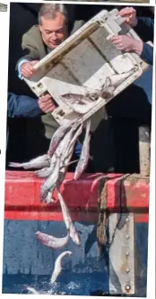  ??  ?? Stunt: Nigel Farage throws haddock off the fishing boat near Parliament