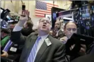  ?? RICHARD DREW — THE ASSOCIATED PRESS ?? Trader Daniel Ryan works on the floor of the New York Stock Exchange Friday.