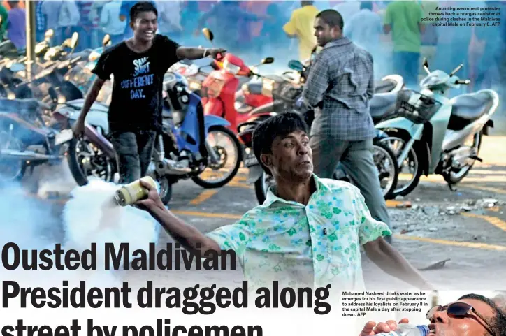  ??  ?? An anti-government protester throws back a teargas canister at police during clashes in the Maldives
capital Male on February 8. AFP