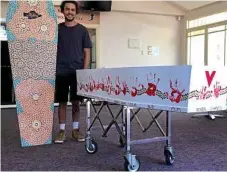  ?? Photo: contribute­d ?? ARTFUL TRIBUTE: Aboriginal artist Kane Brunjes with Ashley Boney's coffin adorned with Aboriginal artwork.