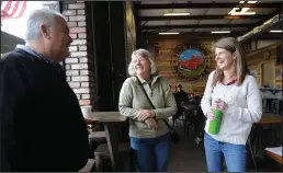  ??  ?? Lodi House board members Richard Mahoney, left, Christi Kennedy Weybret, center, and Executive Director Shelby Young chat as KAT Country radio 103.3 broadcasts from Five Window Beer in Lodi on Thursday. The segment is part of the station’s 10 Deeds in...