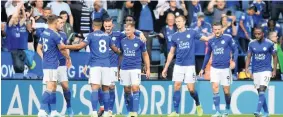  ?? ROSS KINNAIRD / GETTY ?? HOTSHOT: City celebrate after Jamie Vardy’s opener against Bournemout­h