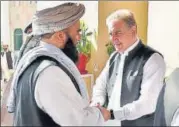  ?? AP ?? Taliban leader Mullah Baradar (left) being received in Islamabad by ■ Pakistan’s foreign minister SM Qureshi.