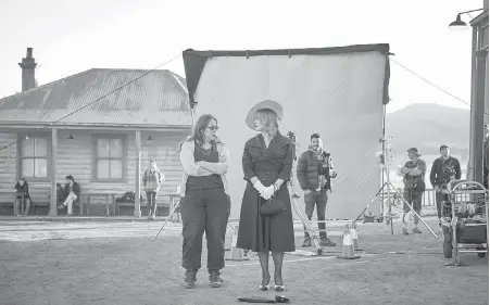  ??  ?? Director Jocelyn Moorhouse, left, and Kate Winslet on the set of the film, The Dressmaker.