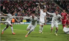  ?? Photograph: Adam Pretty/Bongarts/Getty Images ?? Sergio Ramos (centre) celebrates one of two goals he scored in Real Madrid 5-0 aggregate win over Pep Guardiola’s Bayern Munich.