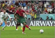  ?? PETR DAVID JOSEK — THE ASSOCIATED PRESS ?? Portugal’s Bruno Fernandes scores his side’s second goal from the penalty spot during a World Cup Group H match against Uruguay at the Lusail Stadium in Lusail, Qatar, on Monday.