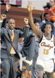  ?? [PHOTO BY BRYAN TERRY, THE OKLAHOMAN] ?? Oklahoma State’s Isaac Likekele (13) enjoyed being able to spend time with his family over the holiday, and he and coach Mike Boynton both sense more energy around the team since the players returned from a brief break.