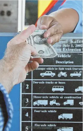  ?? STAFF FILE PHOTO BY STUART CAHILL ?? KEEP THE CHANGE: MassDOT’s implementa­tion of electrioni­c tolling is set to net the Bay State $5 million in savings, while toll takers, above, took home $12 million in buyouts.