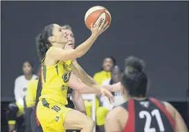  ?? PHELAN M. EBENHACK — THE ASSOCIATED PRESS ?? Seattle Stormguard Sue Bird (10) goes up to shoot between Las Vegas Aces center Carolyn Swords, rear, and guard Kayla McBride (21) during the second half of Game 2of basketball’s WNBA Finals, Sunday, in Bradenton, Fla.