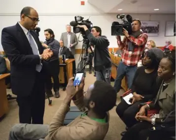  ?? J.P. MOCZULSKI FOR THE TORONTO STAR ?? J. Philip Parappally, head of the York Region District School Board, apologizes for racism experience­d by two mothers, Jacqui Testoni, seated on the left, and Charline Grant, right.