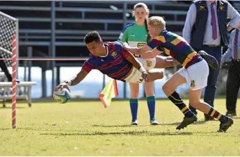  ?? Photos: Kevin Farmer ?? FLYING HIGH: Riley Darr dives over for a Downlands First XV try against Sunshine Coast Grammar at Downlands College last Saturday.