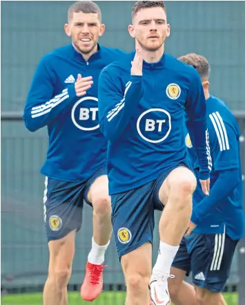  ??  ?? Skipper Andy Robertson and Ryan Christie leading the way in training.