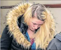  ?? RYAN TAPLIN/THE CHRONICLE HERALD ?? Bethany MacLean leaves a courtroom at Halifax provincial court on Tuesday. MacLean was sentenced to house arrest after letting a dog starve to death.