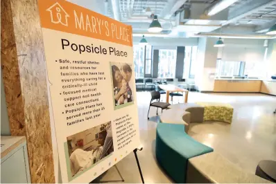  ?? AP Photo/Ted S. Warren ?? A sign outlines services offered by the Popsicle Place shelter program June 17 at Mary's Place, a family homeless shelter located inside an Amazon corporate building on the tech giant's Seattle campus. The Popsicle Place shelter program is an initiative to address the needs of homeless children with life-threatenin­g health conditions.