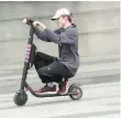  ?? — Reuters ?? A man rides a Lyft scooter near the White House in Washington.