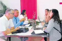  ?? FILE ?? People doing business in a section of the Jamaica Tourist Board’s space at Caribbean Travel Marketplac­e at the Montego Bay Conference Centre in 2019.