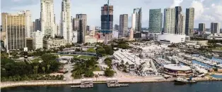  ?? MATIAS J. OCNER mocner@miamiheral­d.com ?? According to data from Miami Mayor Francis Suarez’s office, 5,896 positions have been promised by companies that moved to Miami between Oct. 2020 and Nov. 2021. Most of these firms are tech-oriented. Of that total, 1,909 new hires are now working in Miami.