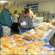  ?? TONY PHYRILLAS — DIGITAL FIRST MEDIA ?? Thousands of loaves of braided Greek sweet bread, all baked by the women at Sts. Constantin­e & Helen Greek Orthodox Church, will be on sale at the Greek Food Bazaar along with a variety of Greek pastries.