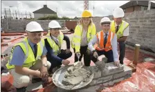  ??  ?? Louth County Council Chief Executive Joan Martin with Minister Damien English at the North & East Housing Associatio­n site.