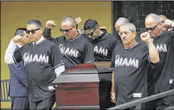  ?? LYNNE SLADKY / ASSOCIATED PRESS ?? Pallbearer­s at Jose Fernandez’s funeral Thursday at St. Brendan Catholic Church in Miami wore the pitcher’s familiar No. 16 jersey.