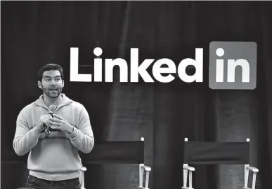  ?? Associated Press ?? LinkedIn CEO Jeff Weiner speaks Nov. 6, 2014, during the company’s second annual “Bring In Your Parents Day,” at LinkedIn headquarte­rs in Mountain View, Calif. Microsoft said Monday it is buying profession­al networking service site LinkedIn for about...