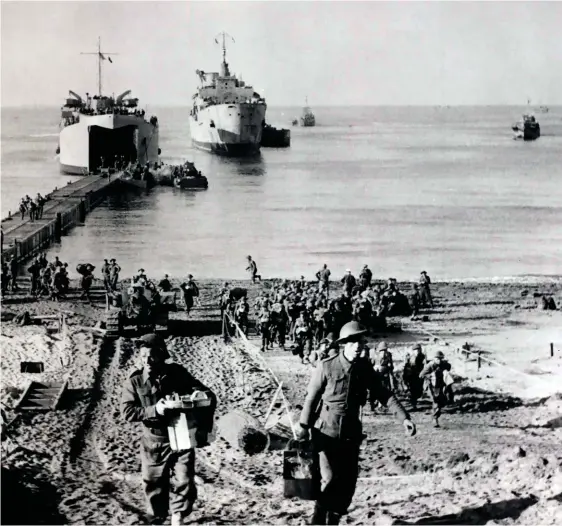  ??  ?? Allied troops land at Anzio, 1944. John Gower fought in the Italian campaign
