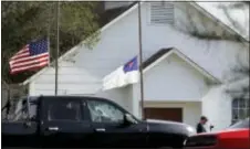  ?? ERIC GAY — THE ASSOCIATED PRESS FILE ?? In this file photo, flags fly at half-staff as law enforcemen­t officials continue to investigat­e the scene of a shooting at the First Baptist Church of Sutherland Springs in Sutherland Springs, Texas. The AP reported on that a story claiming a man who...