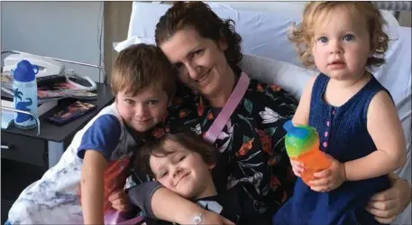  ??  ?? Michele Beck pictured in Sydney with her three children. Below, with husband Darren and children.
