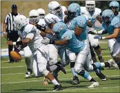  ?? DAN COYRO – SANTA CRUZ SENTINEL FILE ?? Cabrillo College defensive lineman Ty Winn takes down Contra Costa quarterbac­k Jaylen Tregle in its 2019 season opener.