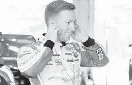  ?? JARED C. TILTON/GETTY ?? Tyler Reddick stands in the garage area during practice for the NASCAR Xfinity Series Ford EcoBoost 300 at Homestead-Miami Speedway. He is the defending Xfinity champion and moves on the Monster Cup circuit next year.