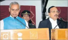  ?? DEEPAK SANSTA /HT ?? Governor Acharya Devvrat administra­ting the oath to newly appointed chief justice of Himachal Pradesh high court Justice Surya Kant at the Barnes Court (Raj Bhawan) in Shimla on Friday.