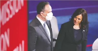  ?? LUCY NICHOLSON/REUTERS ?? U.S. vice-presidenti­al candidate Kamala Harris — here with her husband, Doug Emhoff, following the vice-presidenti­al debate in Salt Lake City, Utah — showed a calm, unflappabl­e presence in debating Mike Pence, Andrew Cohen writes.