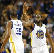  ?? JANE TYSKA/TRIBUNE NEWS SERVICE ?? Warriors' Draymond Green (23) and Kevin Durant (35) celebrate a basket in the second quarter against the Cleveland Cavaliers on Monday in Oakland.