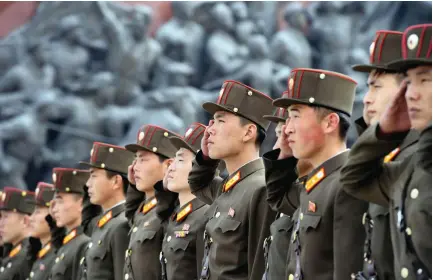  ?? (KCNA/Reuters) ?? NORTH KOREAN SOLDIERS mark the 85th anniversar­y of the founding of the Korean People’s Army, in this handout photo released yesterday.