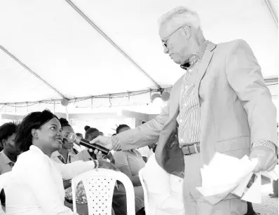  ??  ?? Rear Admiral (ret’d) Peter Brady, director general of the Maritime Authority of Jamaica, interacts with Abigail Bryan, manager, WiMAC Secretaria­t, at the Maritime Awareness Week exposition on Tuesday, September 24.