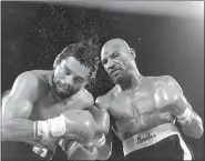  ?? ASSOCIATED PRESS FILE ?? Marvin Hagler sends sweat flying as he pounds challenger Roberto Duran in the ninth round of a 1983 bout in Las Vegas. Hagler scored a unanimous decision over Duran.