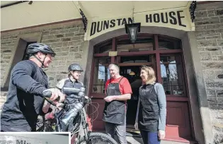  ?? PHOTO: TOURISM CENTRAL OTAGO / JAMES JUBB & REBECCA FOX ?? Stopping for a coffee and a raw slice with Meredith and Ian Kerrisk at Dunstan House is a good way to boost the energy levels. Inset: Paul Wright from Three Miners pours a glass of pinot noir.