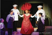  ?? PHOTOGRAPH­Y PHOTO BY RICK FLYNN ?? Tina McPhearson (appearing with ensemble members as waiters of the Harmonia Gardens restaurant) stars as Dolly Levi in the Dayton Playhouse’s production of “Hello, Dolly!”