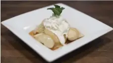  ??  ?? Perogy for dessert. Topped with caramelize­d apples and whipped cream.