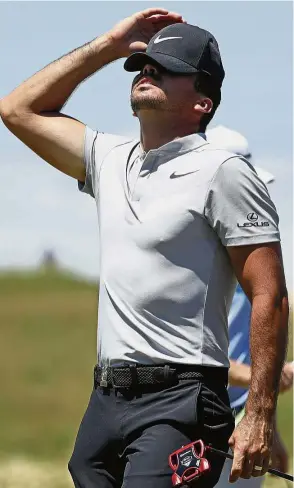  ??  ?? Horror show: Australia’s Jason Day reacting on the ninth hole in the second round on Friday. — AP