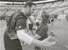  ?? Brett Coomer / Houston Chronicle ?? Texans offensive guard David Quessenber­ry embraces his girlfriend, Maegan Cruse, as she surprises him on the field Wednesday before his return to game action.