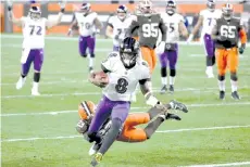  ?? - AFP photo ?? Lamar Jackson #8 of the Baltimore Ravens scores a touchdown during the second quarter in the game against the Cleveland Browns at FirstEnerg­y Stadium in Cleveland, Ohio.