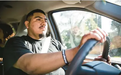  ?? NEWSGROUP MAX WHITTAKER/BAY AREA ?? Undocument­ed immigrant Juan Valentin drives in Stockton, California, a year after he was able to get his driver’s license.