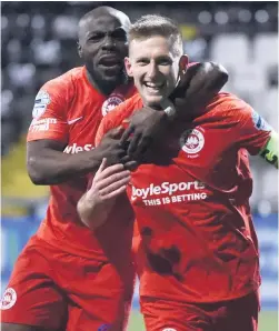  ??  ?? All smiles: Jeff Hughes (right) is hailed by Fuad Sule after his winner