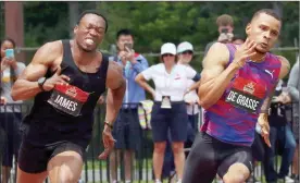  ?? The Canadian Press ?? Andre De Grasse, right, takes the lead to win his heat in the preliminar­y men’s 200-metre race at the Canadian Track and Field Championsh­ips in Ottawa on Saturday.