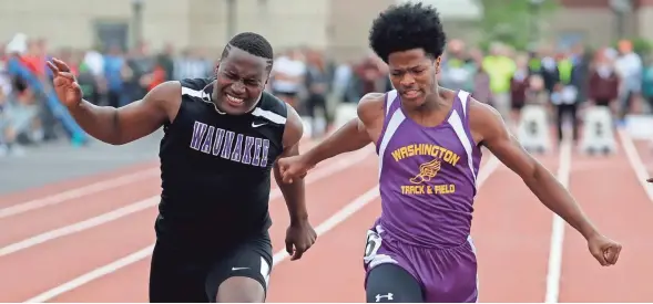  ?? RICK WOOD / JOURNAL SENTINEL ?? Milwaukee Washington’s Elijah Johnson crosses the line ahead of Waunakee’s L.O. Johnson in the boys 100-meter dash Saturday.