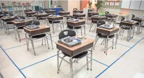  ??  ?? A fourth grade classroom awaits students at Tom Joy Elementary School on
Feb. 1 in Nashville. A bill granting local school boards in Tennessee the authority to open and close schools during a state of emergency passed the state Senate on Monday.